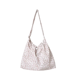 Sac bandoulière floral en toile avec cordon de serrage et bandoulière réglable