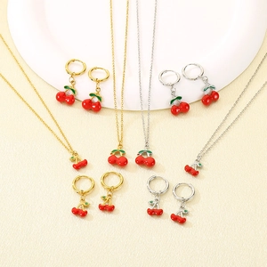 Elegant stainless steel cherry jewelry set including gold and silver necklaces and earrings