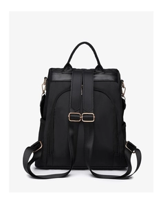 Detail view of the black nylon backpack showing back security pocket and adjustable straps