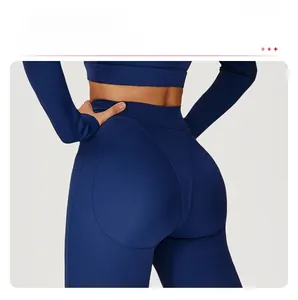 Detail view of ergonomic lifting seams on high-waisted navy blue yoga leggings