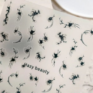 Minimalist Hazy Beauty nail stickers featuring black and white ink floral designs on transparent base