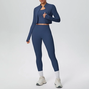 Close-up of navy blue zip-up yoga set with thumbholes and high-waist seamless leggings