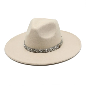 Detail of cream wool fedora with rhinestone band and gold M logo plate on white background