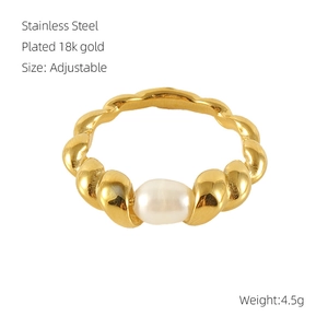 Macro shot of 18k gold plated stainless steel ring featuring a white freshwater pearl