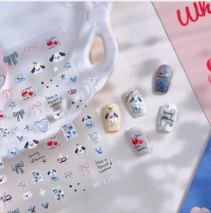 Detail view of M-1182 cartoon puppy nail art stickers with cherry and bow patterns