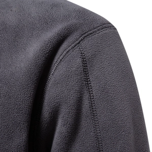 Men's grey fleece sweatshirt showing close-up shoulder seam and high-quality fabric texture