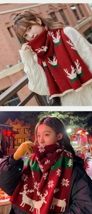 Detail of red Christmas knit scarf featuring festive reindeer and snowflake patterns