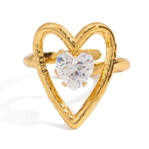 Macro detail of 18K gold stainless steel heart ring with white zircon and hammered texture