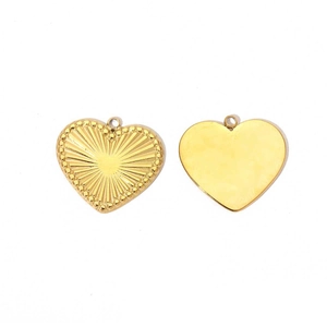 Detail of golden heart pendants featuring radial texture and polished mirror finish