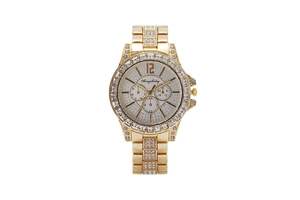 Macro shot of gold quartz watch with rhinestone bezel and silver sunray dial with subdials