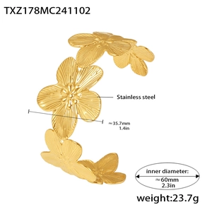 Detailed view of a gold stainless steel flower cuff bracelet with 60mm inner diameter
