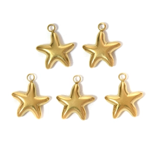 Five golden 304 stainless steel starfish pendants for DIY jewelry making on white background