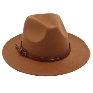 Detail of caramel wool felt Fedora hat with wide brim and dark brown leather belt buckle strap