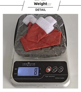 Weight measurement of a mini Christmas wine bottle hat decoration on a digital scale