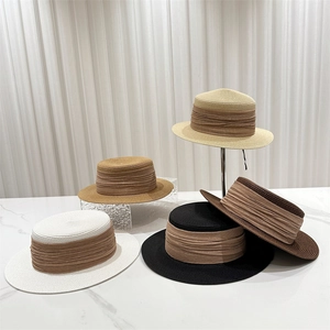 Flat top straw sun hats in five colors with wide ribbon bands for beach and outdoor use
