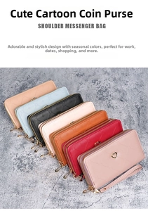 Detail view of double zipper long wallets featuring geometric diamond texture and heart charms