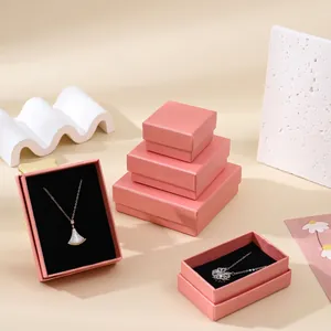Pink jewelry box set with linen texture and black velvet lining for necklaces and rings