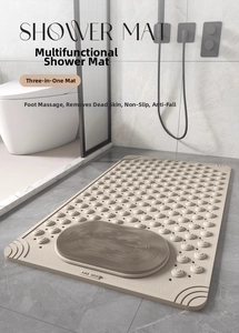 Detailed view of beige shower mat with foot massage bristles and anti-slip suction cups