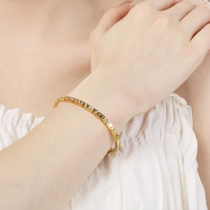 Close-up of 18K gold plated bangle with rectangular cubic zirconia channel setting