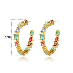 Detail of 4cm gold-plated C-hoop earrings featuring vibrant multi-color zircon stones