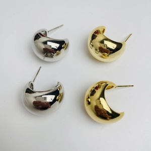 Polished chunky waterdrop earrings in gold and silver finish on white background
