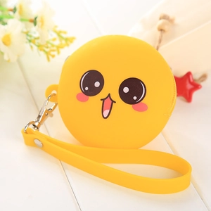 Detail of yellow round silicone coin purse with cartoon face expression and metal carabiner