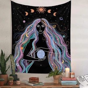 Detail view of a bohemian celestial tapestry with mystic female and moon phases on a white wall