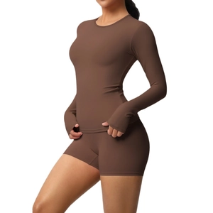 Two-piece yoga set with long sleeve thumb hole top and high waist shorts in chocolate brown