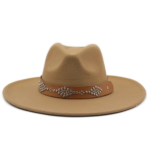 Detail of camel wool felt fedora featuring a leather band with silver rivet geometric patterns