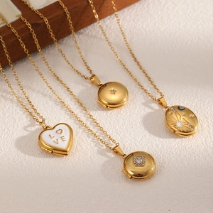 Gold locket necklace collection featuring heart, star, and celestial engraved pendants
