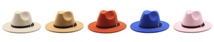 Various colors of wool jazz fedora hats with black leather belts on white background