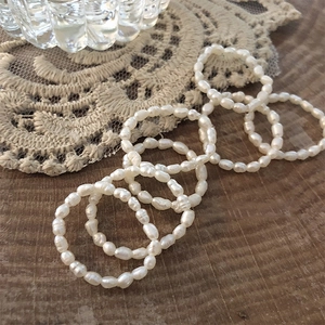 Handmade Baroque freshwater pearl ring set with seven minimalist beaded strands on lace