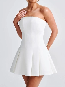 Detail of white strapless pleated mini dress with corset stitching and elegant bodice