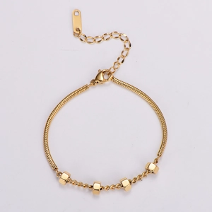 Detail of gold snake chain bracelet with hexagon beads and adjustable lobster clasp