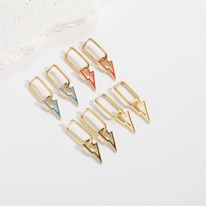 Set of four gold lightning bolt charm earrings in red, blue, black, and gold enamel