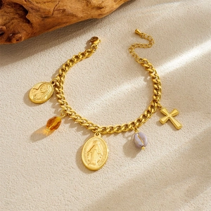 Detail of 18K gold-plated Cuban chain bracelet with Virgin Mary and cross pendants
