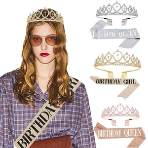 Close-up of birthday crown and sash set in gold, silver and rose gold color options