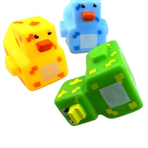Set of pixel-style rubber ducks in yellow, blue and green colors for bath time fun