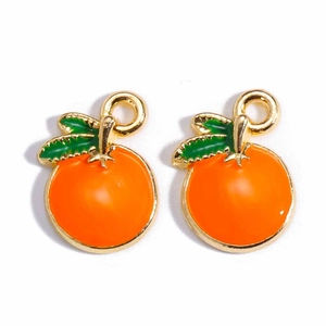Detailed close-up of orange fruit charms with gold metal edges and green leaves for DIY jewelry