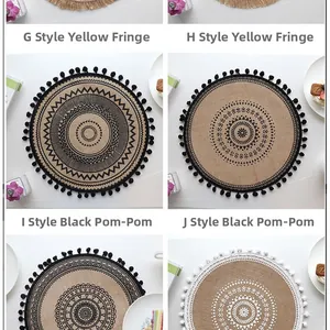 Detailed view of four round jute placemats with bohemian geometric patterns and tassels