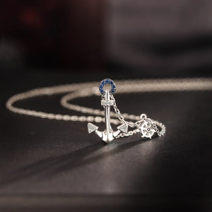 Elegant S925 sterling silver nautical necklace with blue crystal anchor and rudder pendant
