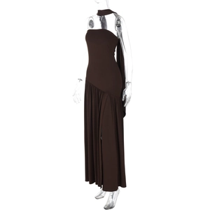 Detailed view of brown strapless maxi dress featuring side slit and elegant flowing ribbons