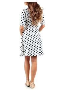 Rear view of white maternity midi dress with navy blue polka dot print and short sleeves