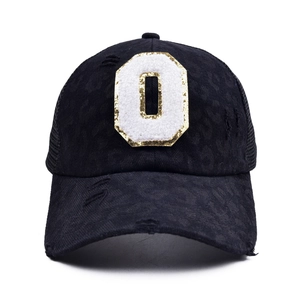 Detail of leopard print baseball cap with sequined letter O and mesh back