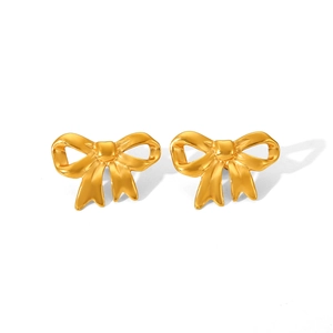 Close-up of elegant 18K gold plated stainless steel bow earrings on white background