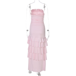Rear view of pink tiered ruffle maxi dress featuring a slim fit and layered cake skirt style
