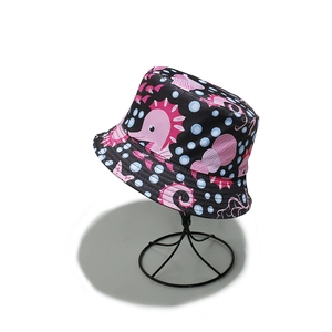 Close-up of seahorse and starfish patterns with reinforced stitching on a black sun hat