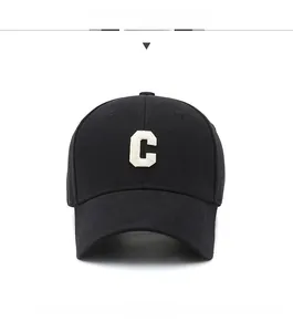Front view of black cotton baseball cap with white C letter embroidery on center