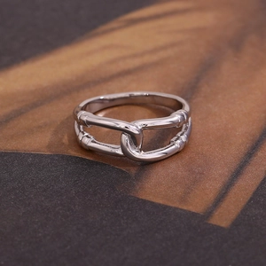 Detailed macro view of the silver double-layer cutout link ring with polished finish