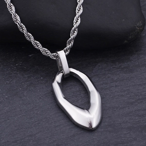 Polished silver stainless steel twist chain with irregular hollow oval pendant on stone